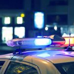 Police car with lights on at night.