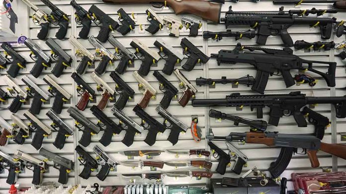 1096565819 featured image Wall display with handguns and rifles for sale.