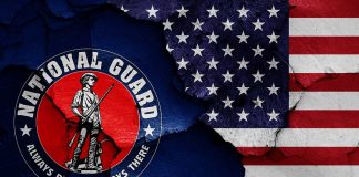 National Guard logo over a distressed American flag.