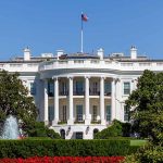 White House with fountain and flag visible