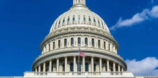 US Capitol building with American flag flying