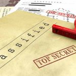 Classified documents with top secret stamps and stamp