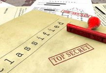 Classified documents with top secret stamps and stamp