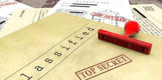 Classified documents with top secret stamps and stamp