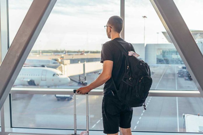 1485626897 featured image Person with backpack at airport window watching airplanes