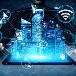 Holographic city above tablet with technology icons