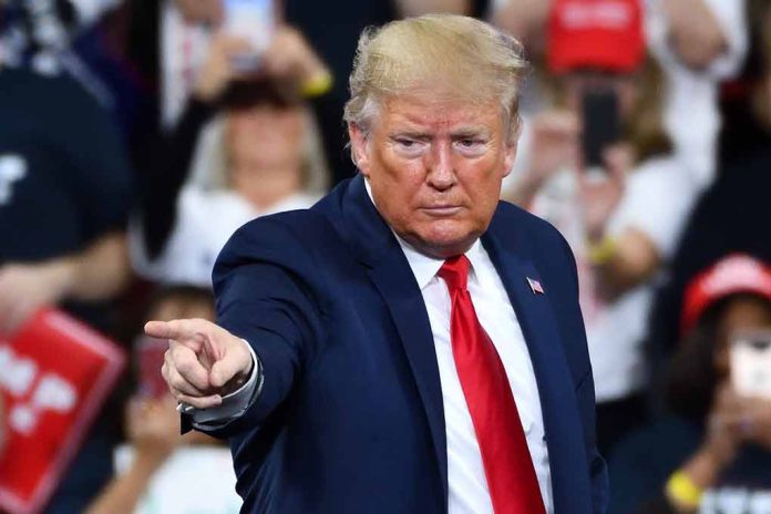 1585235179 featured image Man in suit pointing at rally audience