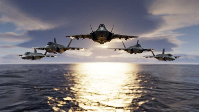 1593281419 featured image Five fighter jets flying over the ocean at sunset.