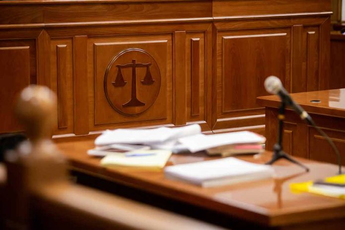 1812892960 featured image Wooden courtroom desk with papers and a microphone
