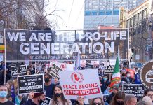Prolife march with large banner and signs
