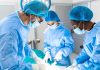 Surgeons performing an operation in a sterile environment