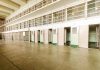 Empty prison cells with open doors two story layout