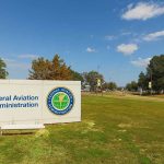Federal Aviation Administration sign on green lawn