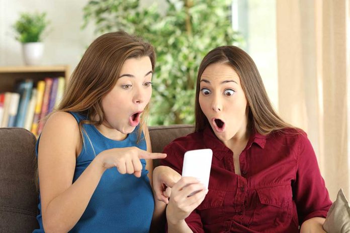 516056992 featured image Two women look surprised at a phone