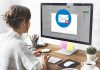 Person viewing email error on desktop computer screen