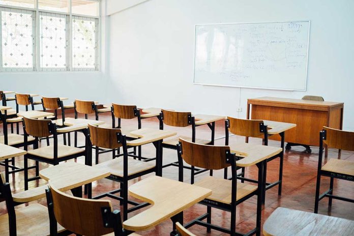 612777398 featured image Empty classroom with desks chairs and whiteboard