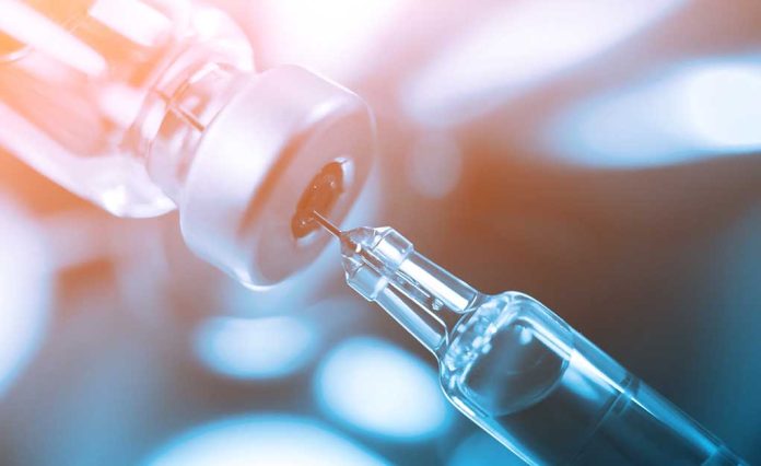735742660 featured image Syringe needle drawing liquid from vial