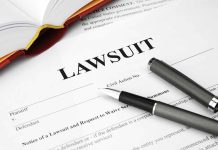 Legal document titled Lawsuit with pen and book
