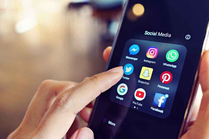 Finger tapping smartphone social media app icons