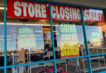 Store closing sale with going out of business signs