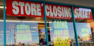 Store closing sale with going out of business signs