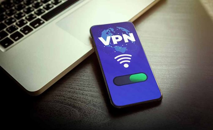2033310410 featured image Smartphone displaying VPN app beside a laptop