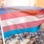 Transgender pride flag waving at outdoor event