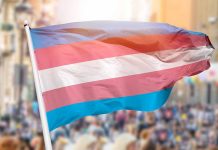 Transgender pride flag waving at outdoor event