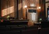 Empty courtroom with judge's bench and wooden decor