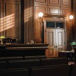 Empty courtroom with judge's bench and wooden decor