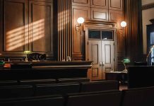 Empty courtroom with judge's bench and wooden decor