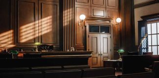 Empty courtroom with judge's bench and wooden decor