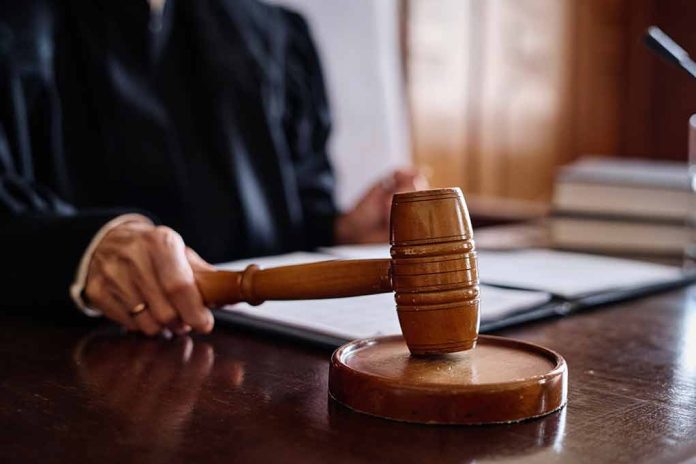 Judge holding gavel in courtroom