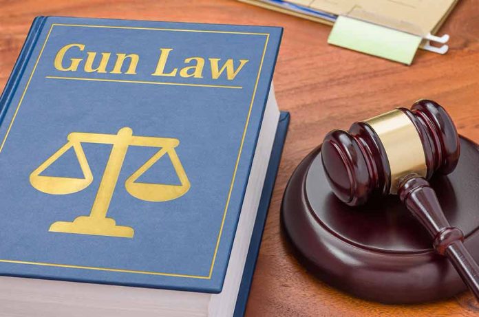 431719843 featured image "Gun Law" book and gavel on wooden desk.