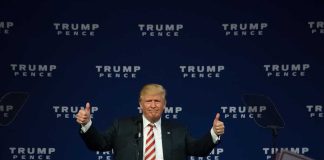 Man giving thumbs up at Trump Pence rally