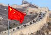 Chinese flag by the Great Wall of China.