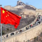 Chinese flag by the Great Wall of China.