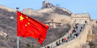 Chinese flag by the Great Wall of China.