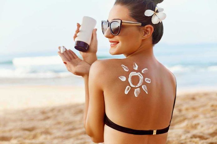 1368652109 Woman applying sunscreen at the beach