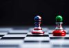 Chess pieces with USA and Iran flags on board