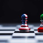 Chess pieces with USA and Iran flags on board
