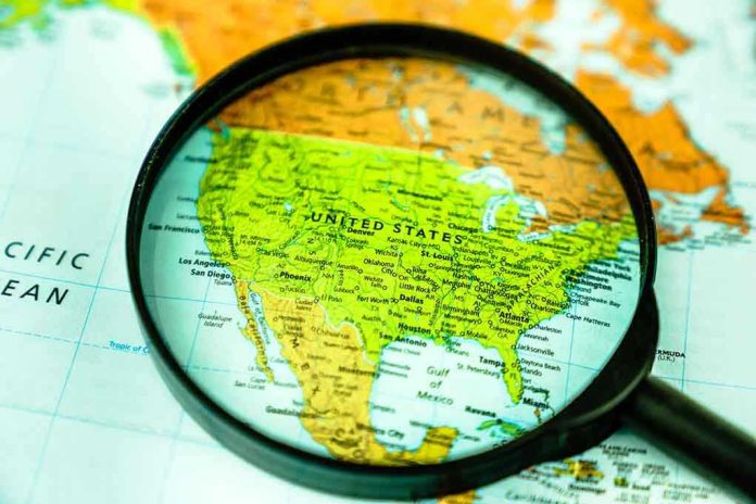 1635435619 Magnifying glass over United States on map