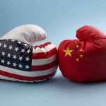 USA and China boxing gloves facing each other