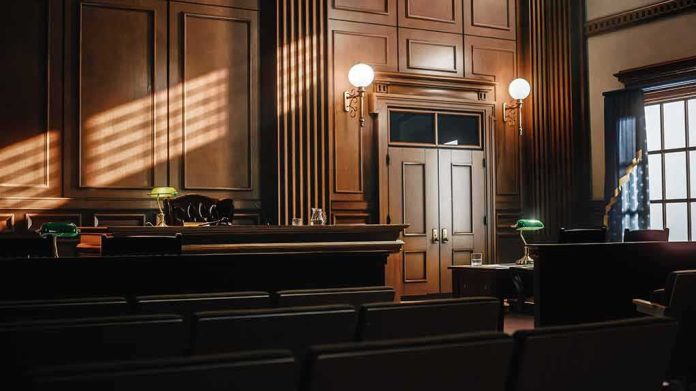2056420763 featured image Empty courtroom with judge's bench and wooden decor