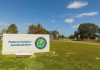 Federal Aviation Administration sign on grassy lawn.