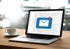 Laptop with email notification on screen at desk