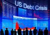Silhouettes of business professionals in front of a digital display showing financial data and a US debt crisis