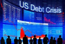 Silhouettes of business professionals in front of a digital display showing financial data and a US debt crisis