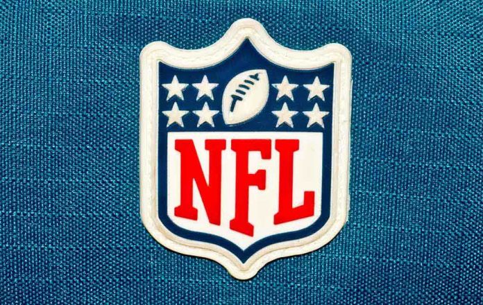 shutterstock_232008589.jpg NFL logo patch on a blue background