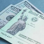 $100 bill and U.S. Treasury check.
